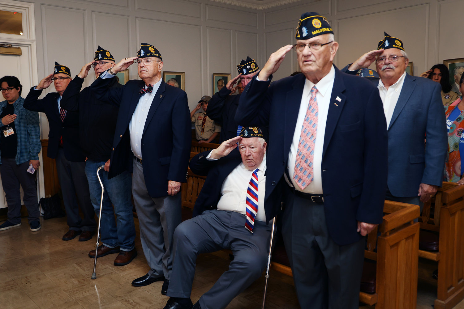 Veterans who attended Malverne’s annual Veterans Day ceremony saluted during the singing of the national anthem by vocalist Kaylee Palmer.