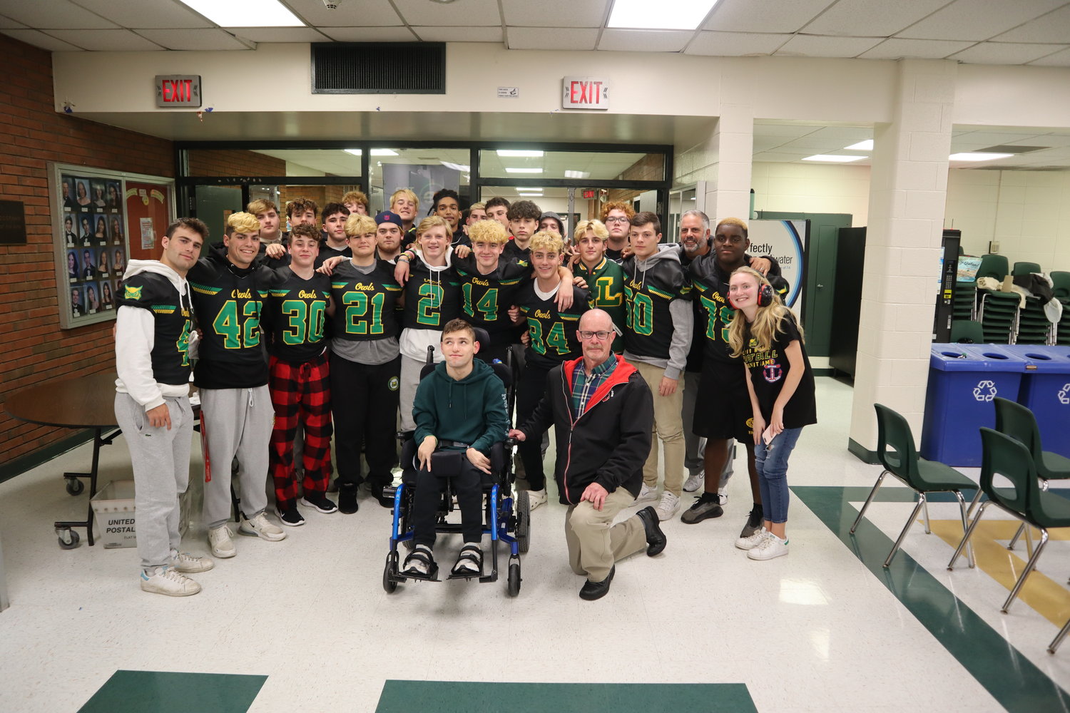 The Lynbrook High School varsity football team recently raised $3,200 for Camp Anchor and gathered at the Nov. 9 board of education meeting.