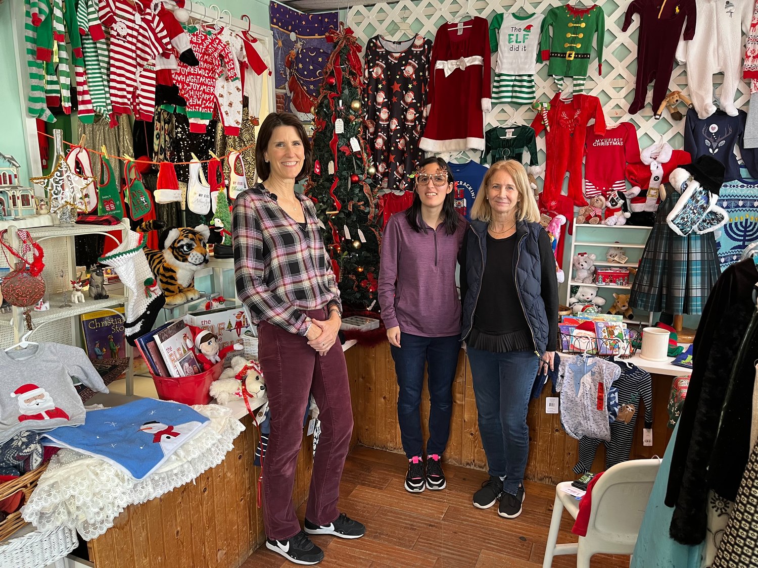 Barbara Costello, right, runs Guardian Angel with the help of volunteers like Susan Sagliocca, center, and Jennifer Marshall. During the holidays, their Giving Tree helps grant children’s wishes.