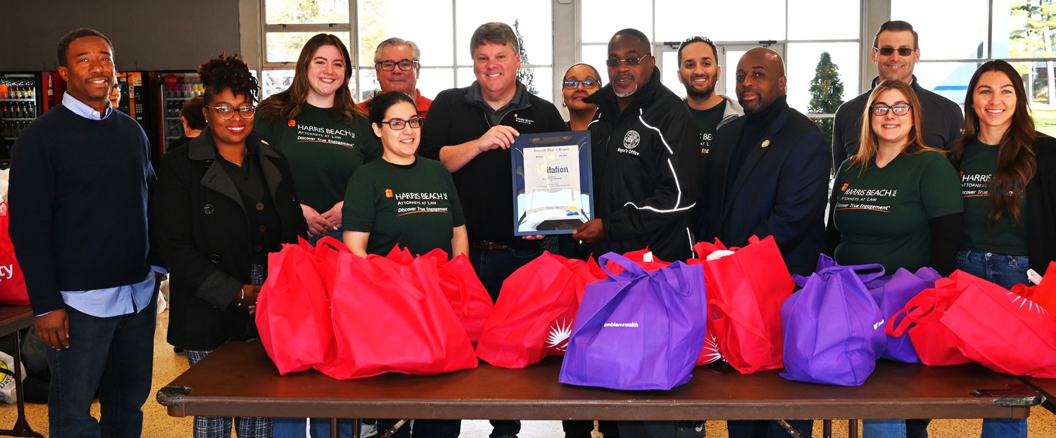 Mayor Waylyn Hobbs, Jr., presented a citation of thanks to attorney Tom Garry of Harris Beach PLLC in Uniondale, Garry’s brother Bill ,and Harris Beach employees for their donations to Hempstead’s Annual Turkey Giveaway 2022. Deputy Mayor Jeffery Daniels (left), Trustee Clariona Griffith (second from left), and Trustee Kevin Boone (to Mayor Hobbs’ left) also participated in the event.