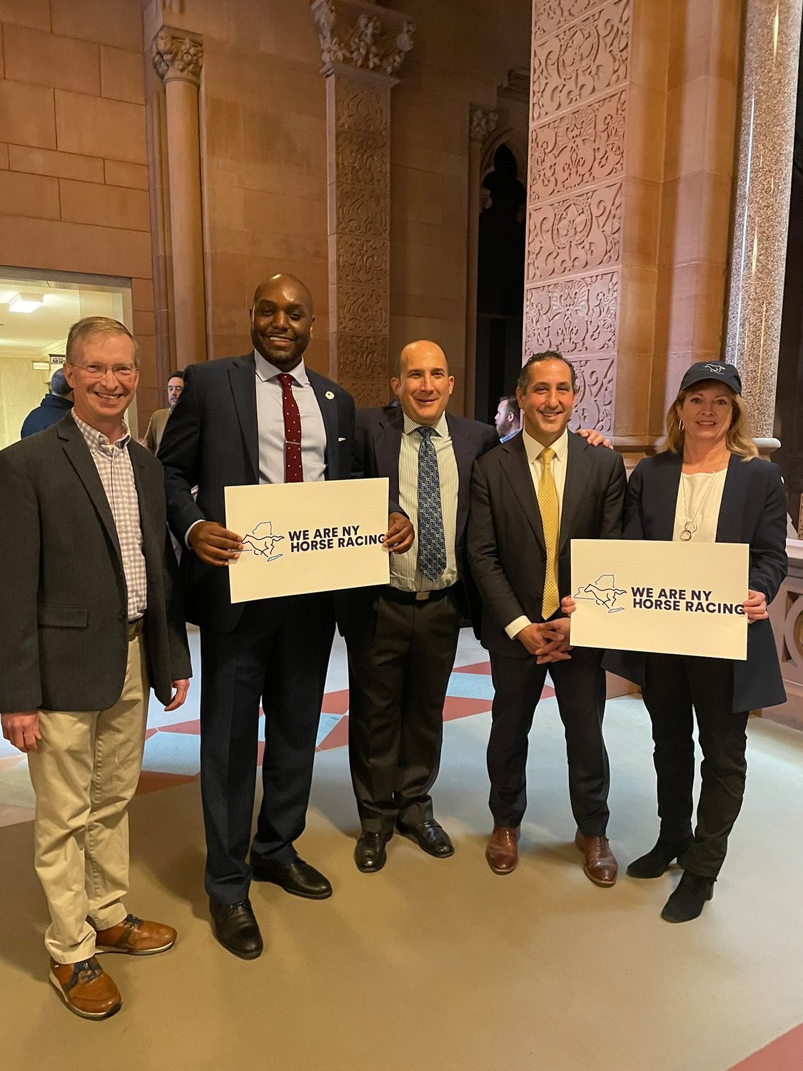 Todd Shimkus, left, of the Saratoga County Chamber of Commerce, Naija Thompson of New York Thoroughbred Breeders, Joe Appelbaum of the New York Thoroughbred Horse Association, Jeff Cannizzo of the New York Racing Association and Heather Mulligan of the Business Council of New York travelled up to Albany to voice their support for the Belmont modernization project.