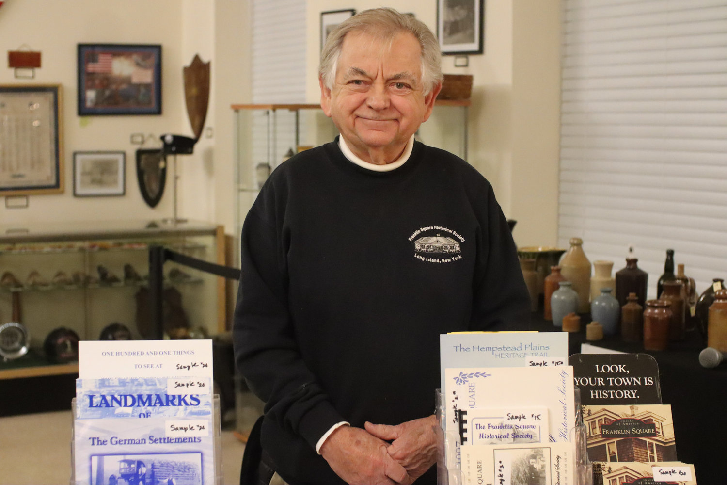 Bill Youngfert, secretary of the Franklin Square Historical Society, welcomes the public to the Franklin Square Museum’s holiday open house. He offered brochures detailing the community’s rich German history.