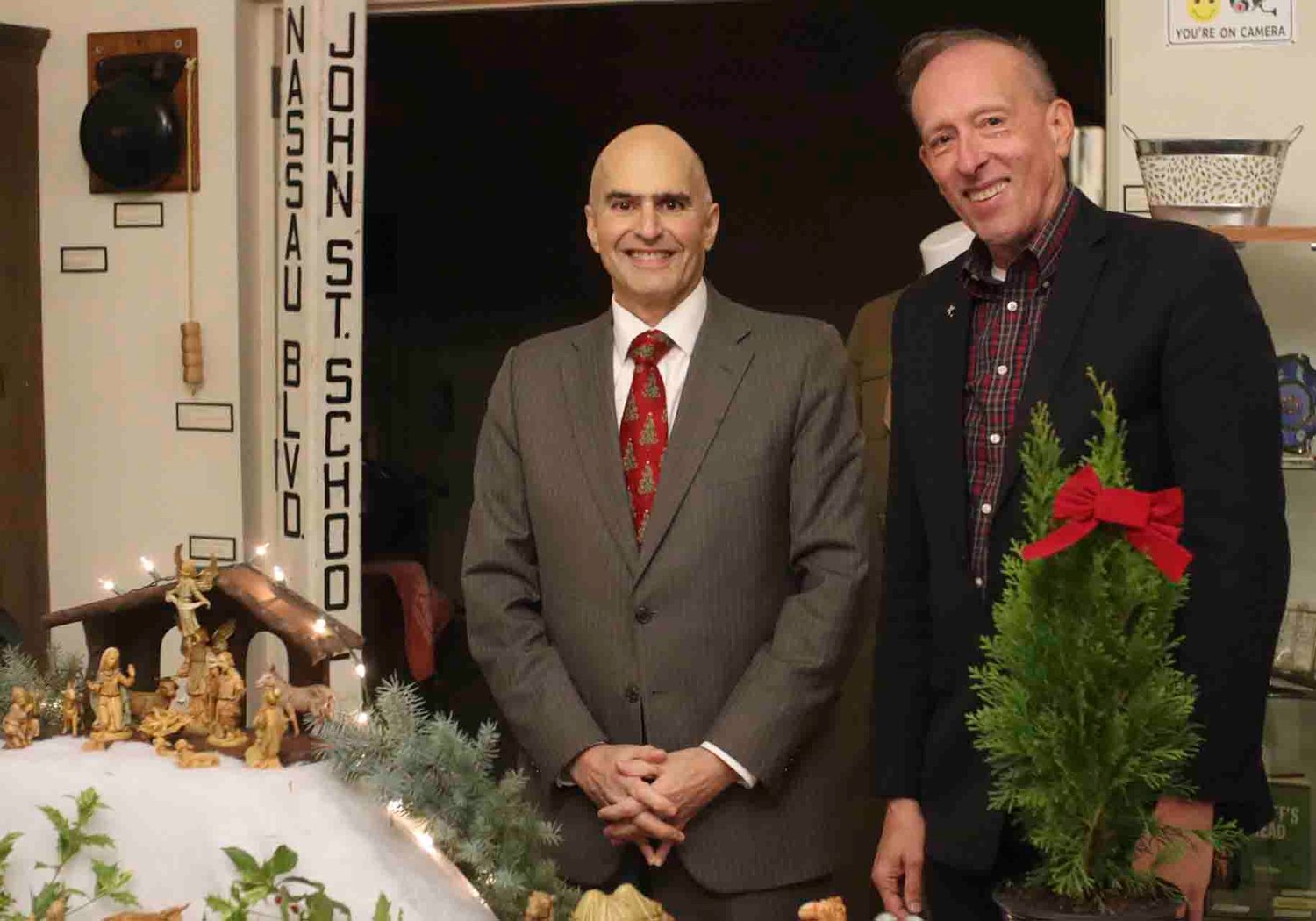 Legislator John Giuffre and past president of the Franklin Square Historical Society Paul VanWie admire the Italian nativity set.