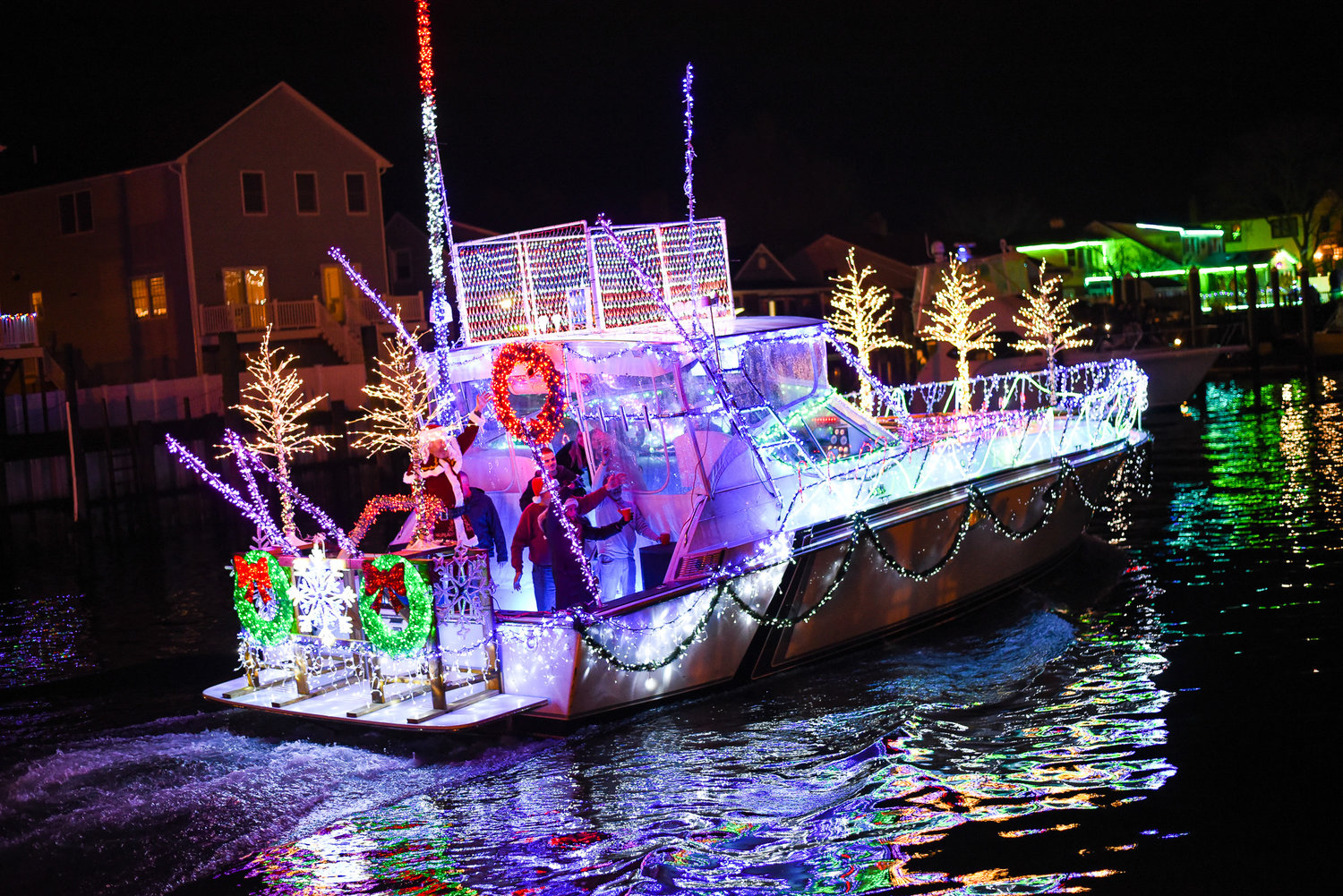 Several dozen boats lit up the Nautical Mile and spread holiday cheer participating in the boat show.