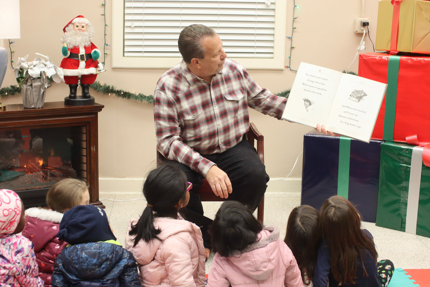 Inside the Community Center, Mayor Edwin Fare did story time with the kids.
