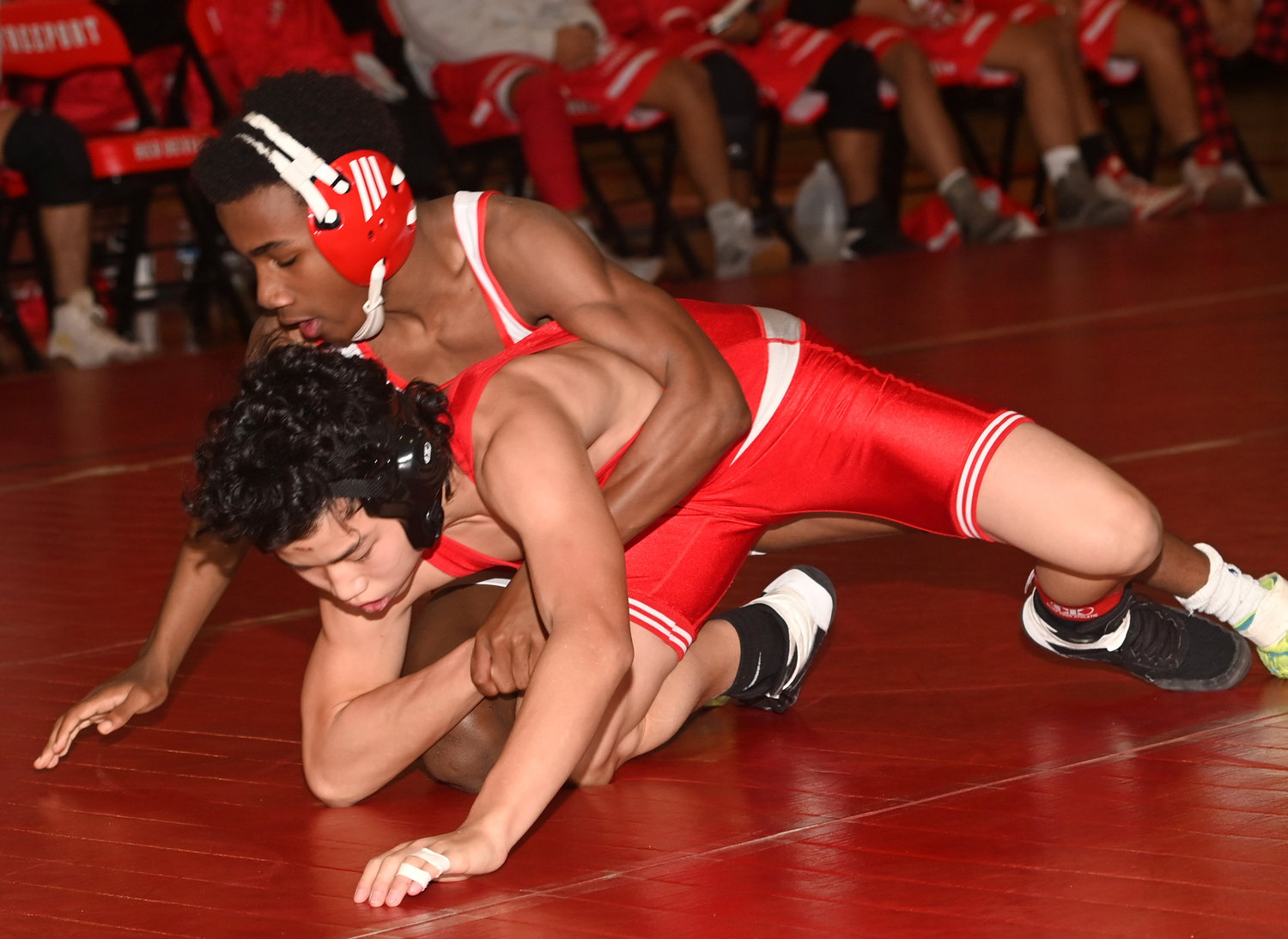 Sophomore 110-pounder Jahari Lloyd, top, is one of the Red Devils’ leading contenders to go deep in the county tournament.