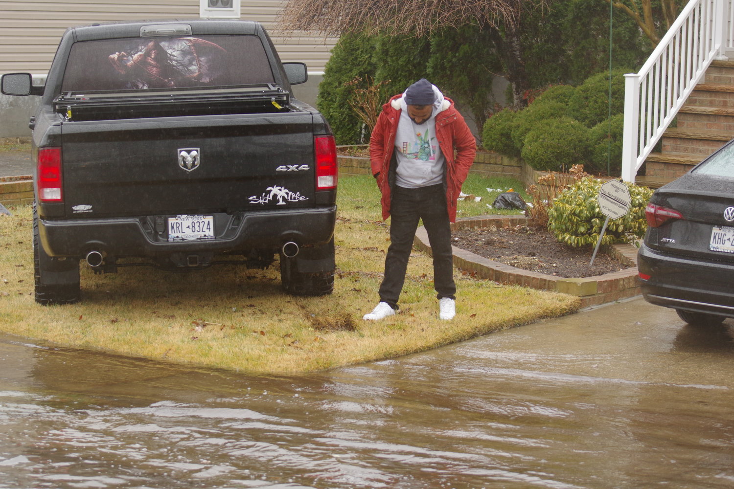 Freeport resident Vishun Rambhajue had to park his car on his lawn due to excessive amount of water in his driveway and the streets.