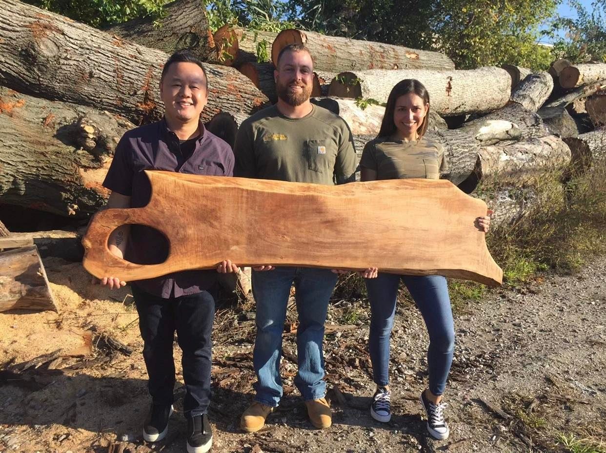 Food Network’s Jet Tila with 1ofAKingLiveEdge owners Isabel and David Doerbecker with Tila’s custom piece. See Tila below with the piece that rivals his own height.