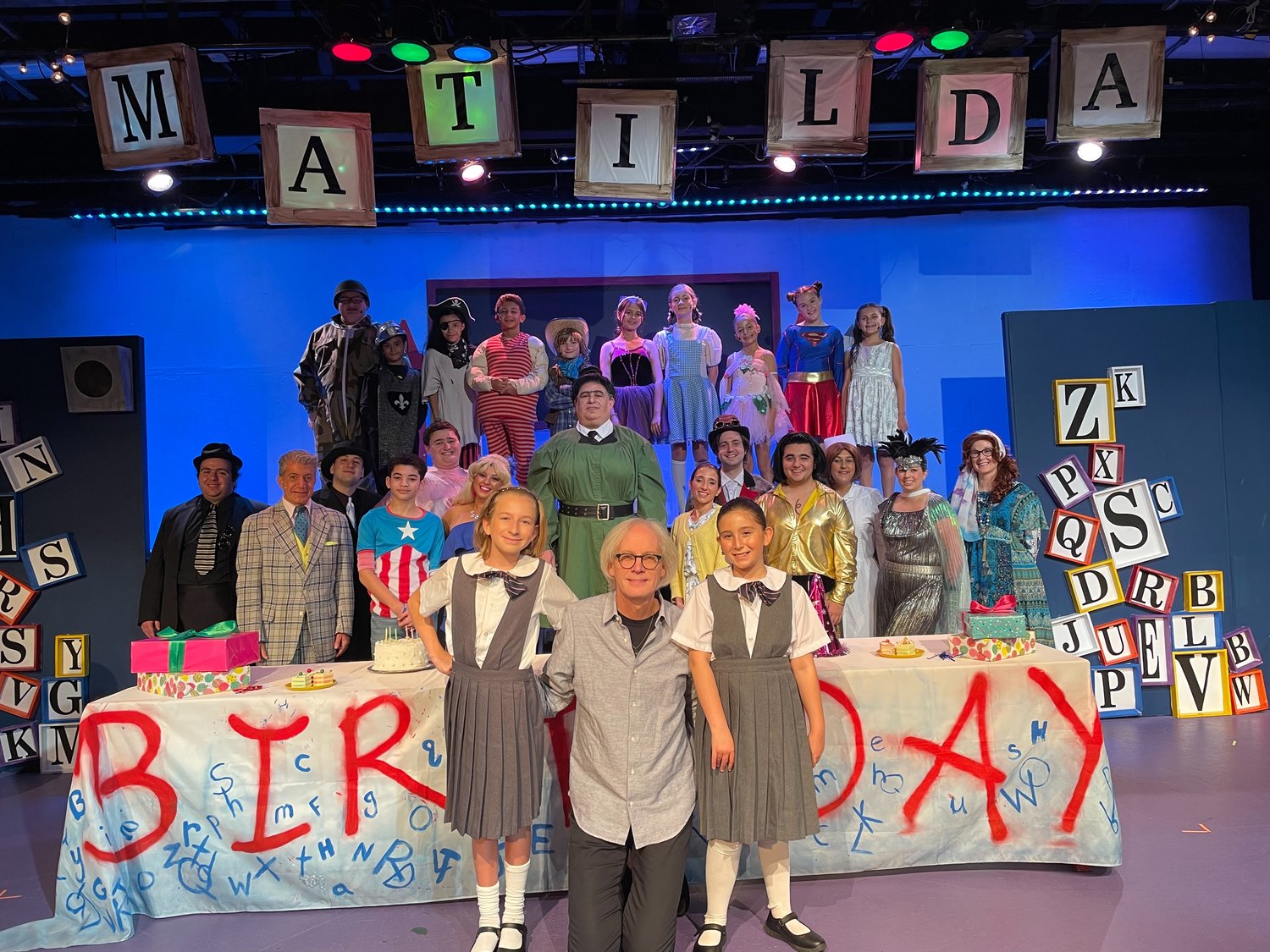 Tarmo Kirsimäe, bottom center, joined the cast of the musical ‘Matilda,’ based on the novel by Roald Dahl. The musical and its venue, Merrick Theatre & Center for the Arts, won Broadway World accolades.