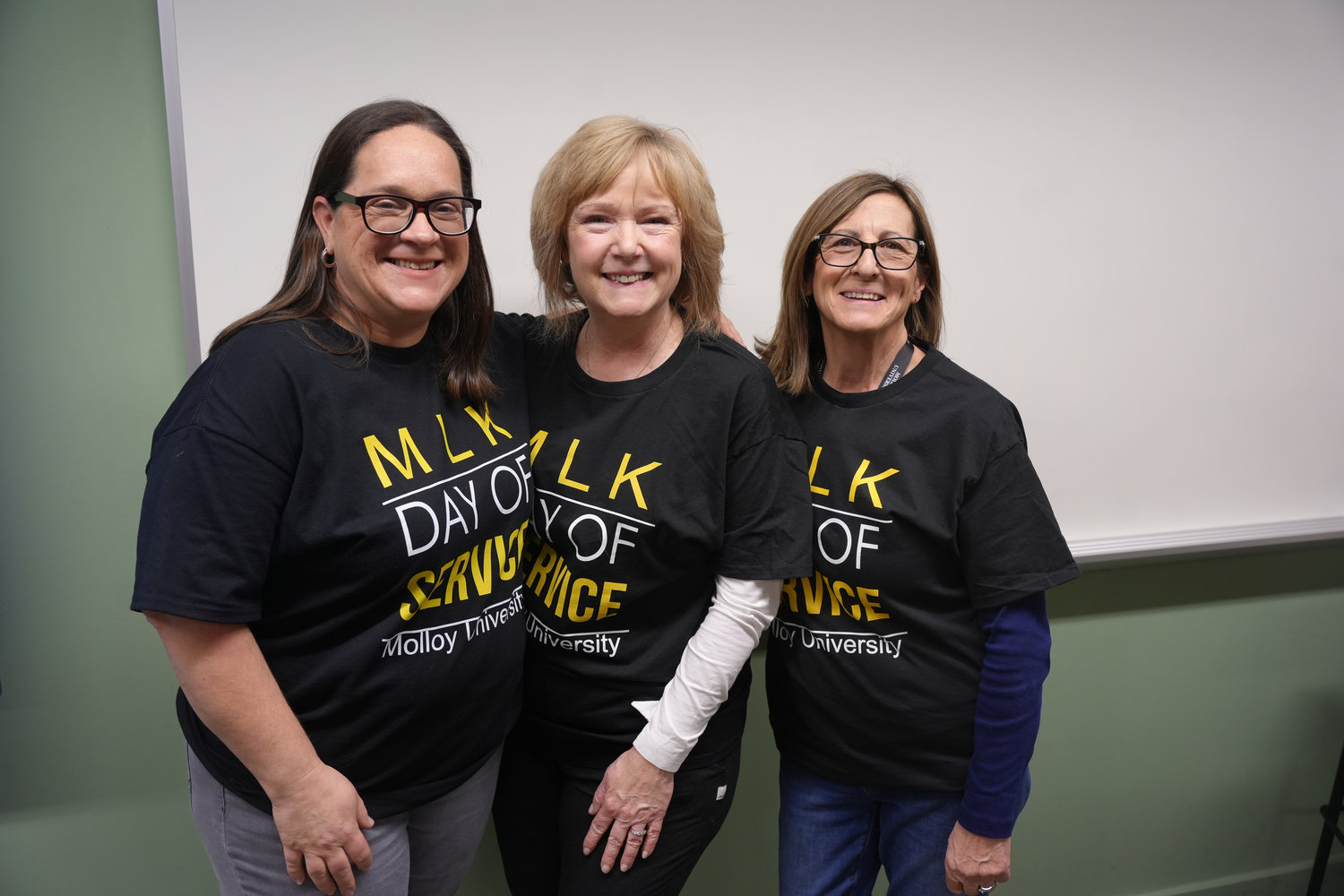 Mary McCormack, Elizabeth Cotter, and Geraldine Moore participate in Molloy University’s MLK Day of Service event.