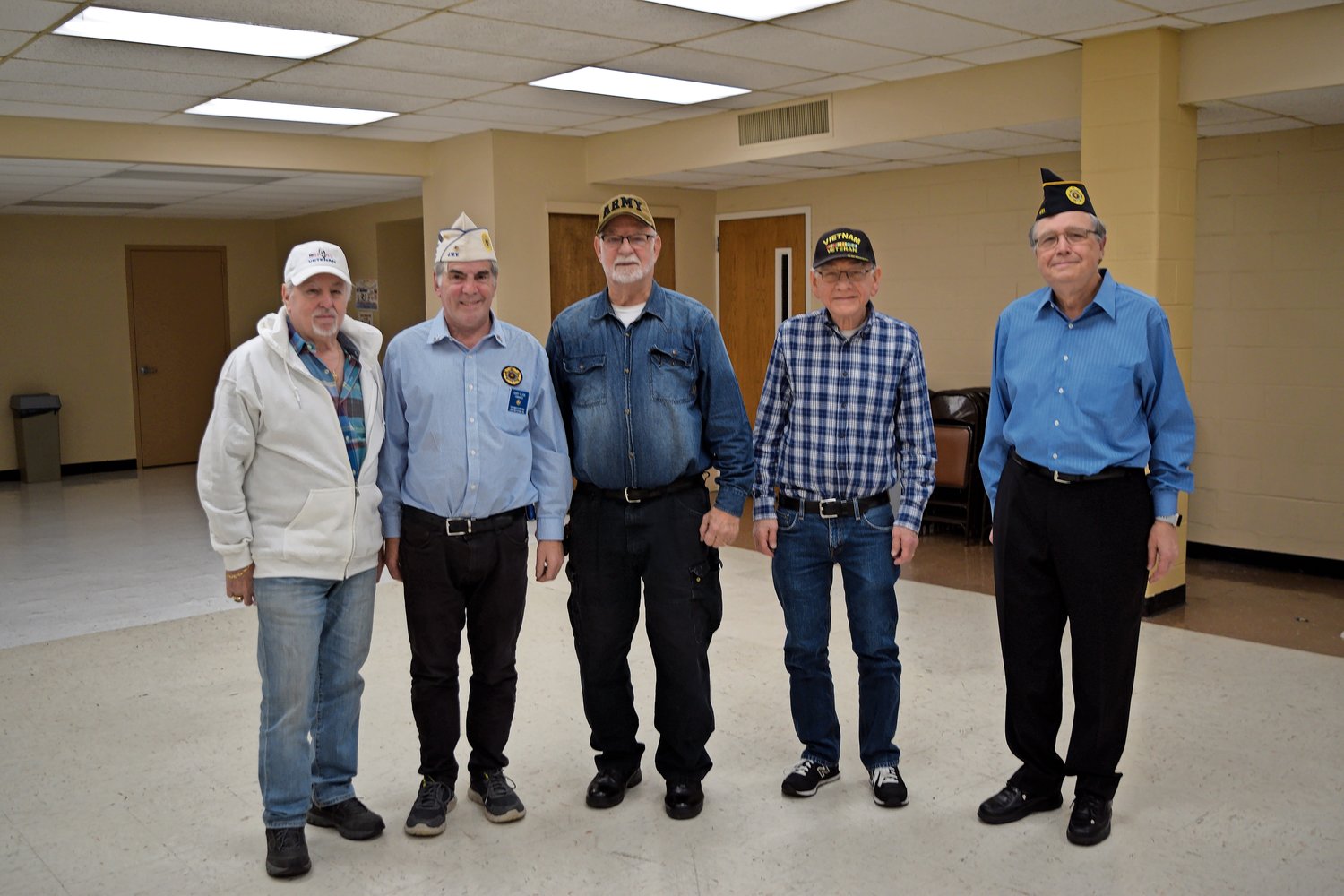 Steve Friedman, far left, Gary Glick, Eric Spinner, Jeff Newman and Freeberg, members of Jewish War Veterans Post 652, which is headquartered in Merrick.
