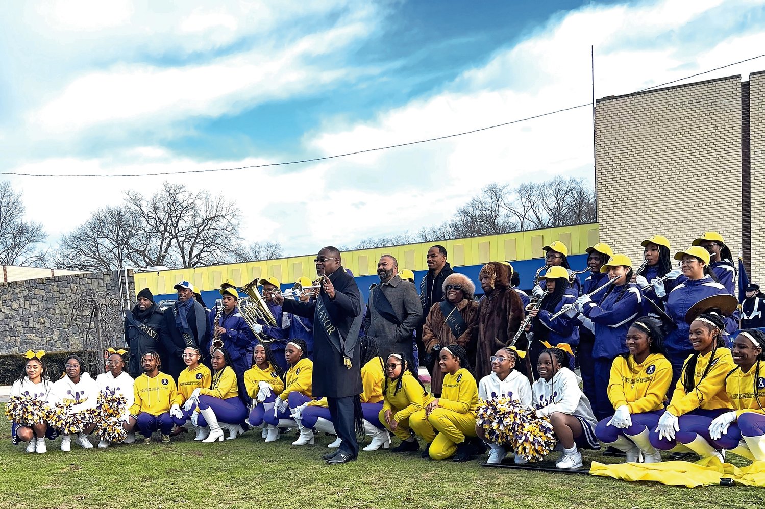 The Academy Marching Panthers, seen here with Mayor Waylyn Hobbs, Jr., New York State Senator Kevin Thomas, Deputy Mayor Jeffery Daniels, and village trustees Kevin Boon and Noah Burroughs, marched in Monday’s MLK Day parade.