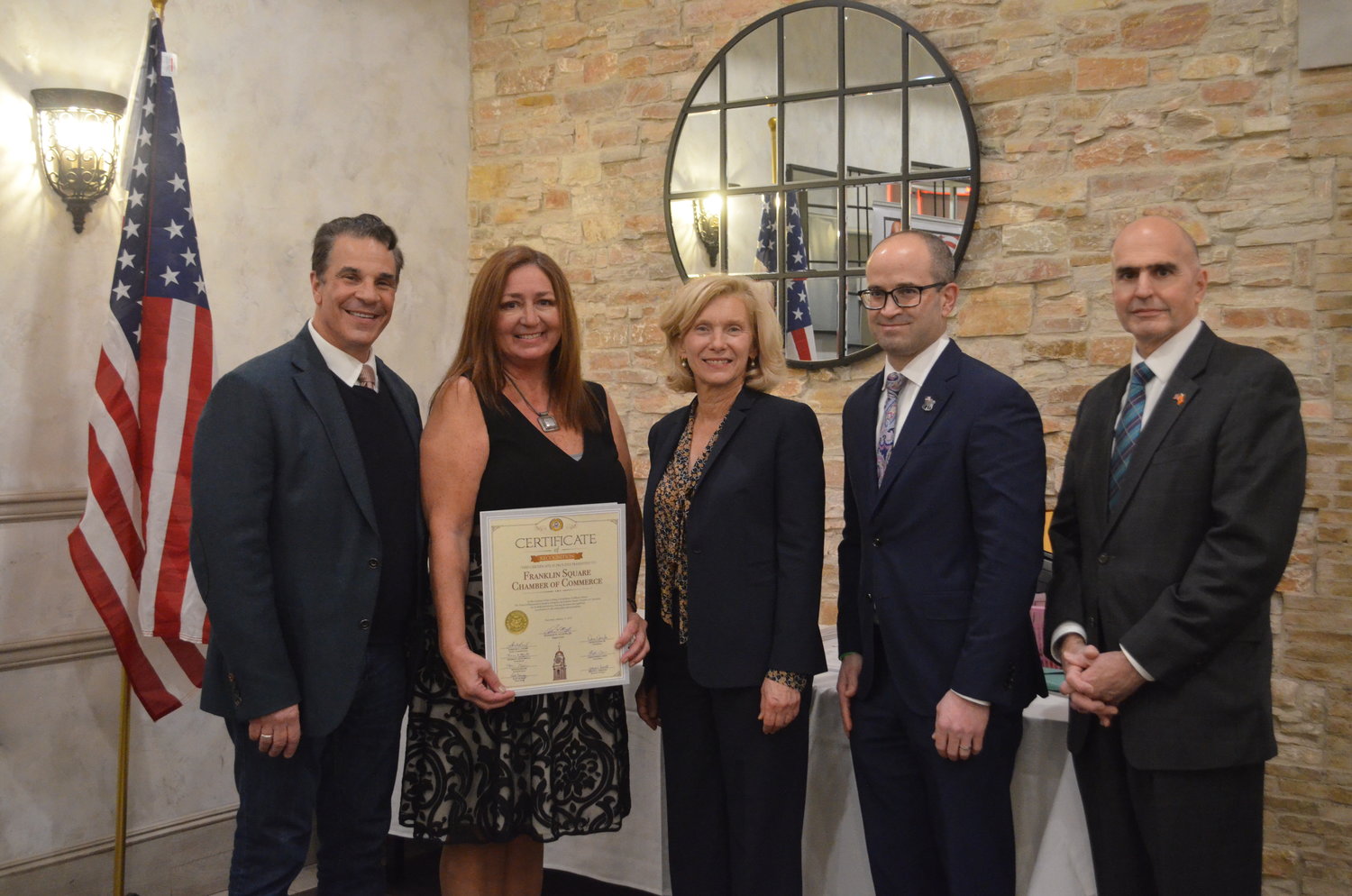 Elected officials presented Chamber President Lisa DelliPizzi, second from left, with a certificate of recognition. With her, from left, were Hempstead Town Councilman Tom Muscarella, Nassau County Comptroller Elaine Phillips, Assemblyman Ed Ra and County Legislator John Guiffrè.