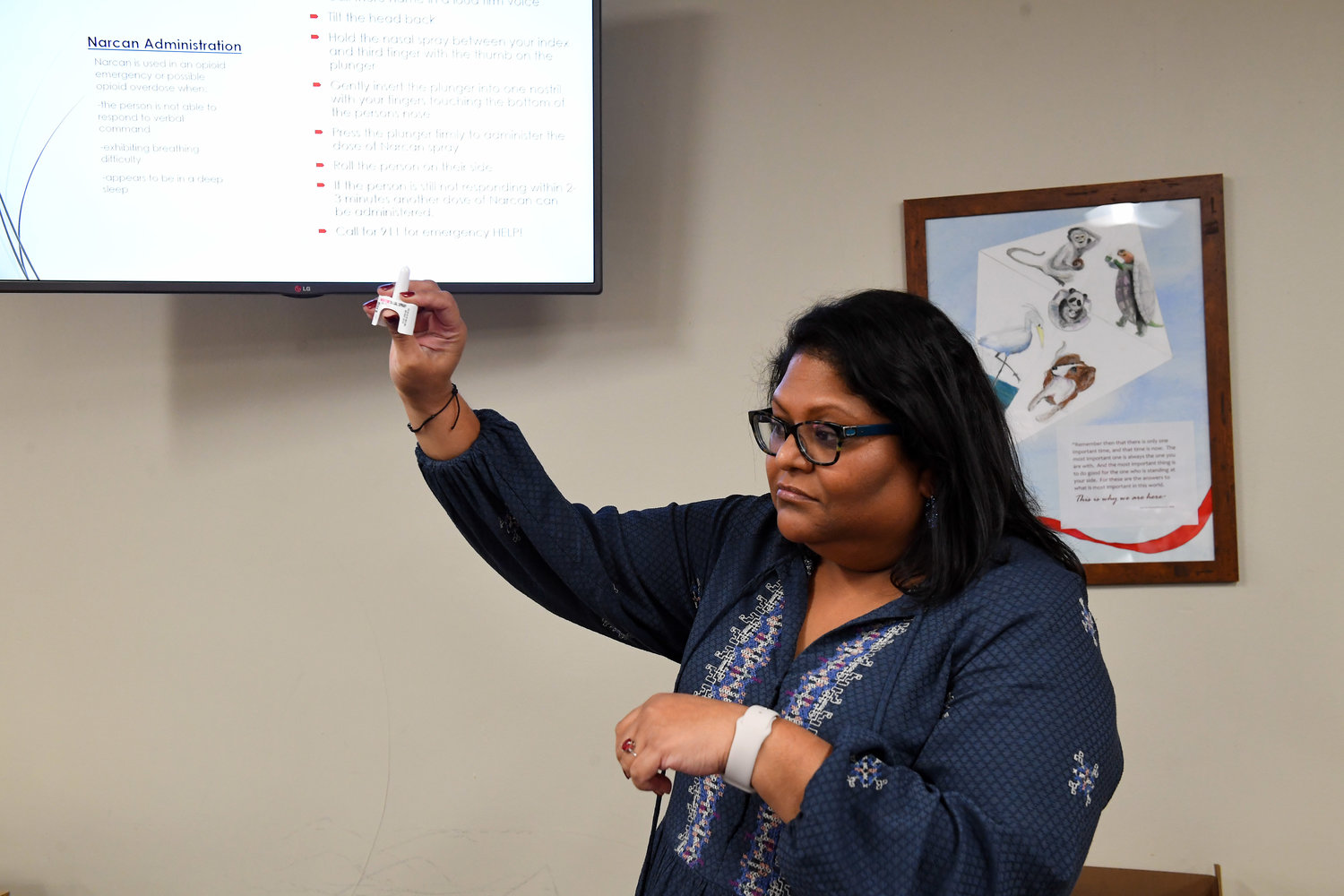 Cindy Wolff, executive director of the Tempo Group, a community counseling center that provided the training, demonstrated how naloxone, a medication that reverses the effects of an overdose, is used.