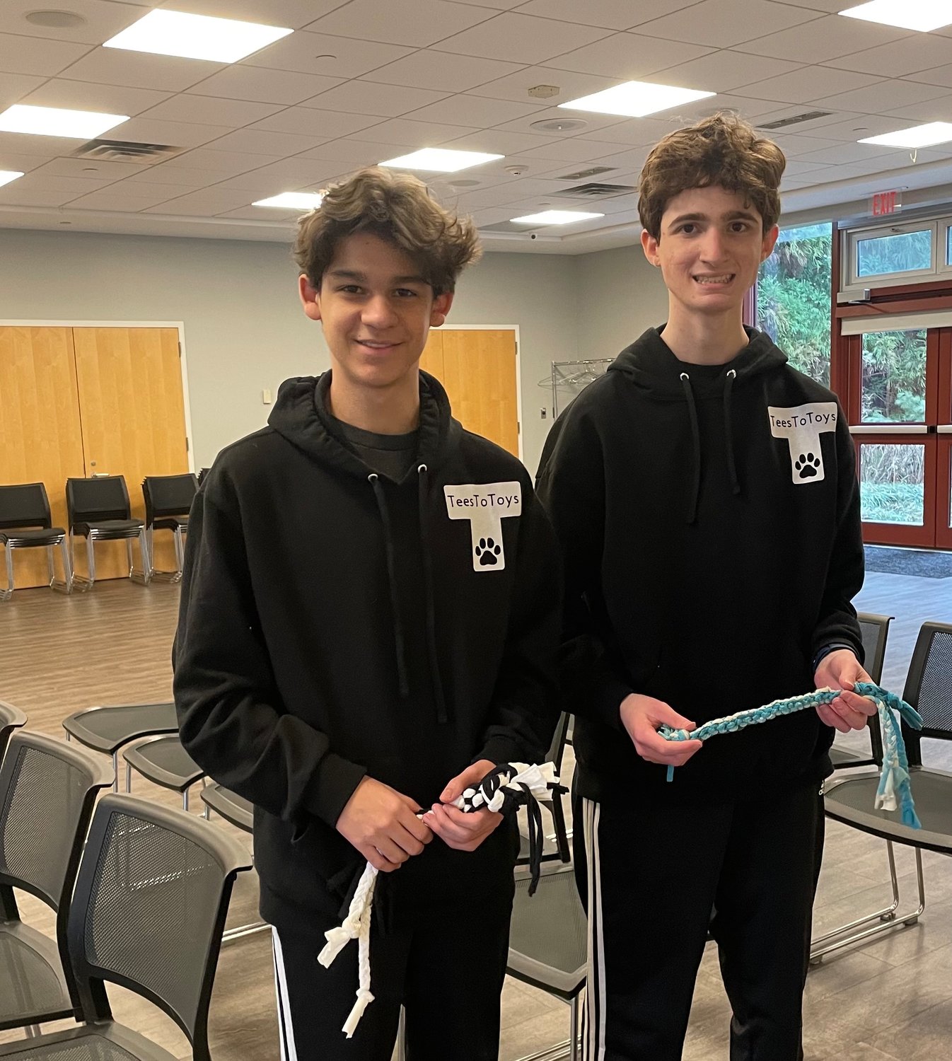 Charlie Matos, 14, left, and Ryan Levinter, 15, started Tees to Toys, which turns old T-shirts into rope toys for animals in shelters.