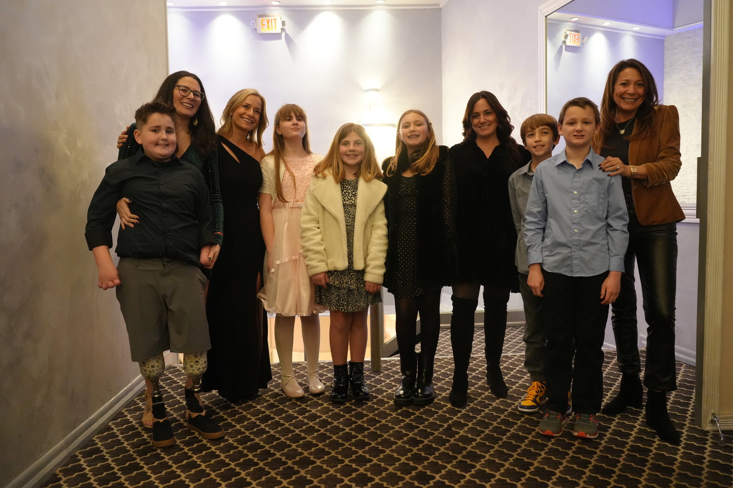 Students and staff from Oceanside’s School No. 5 Project Extra with Ethan Sappington, far left, whom they sponsored for the event, and Show Your Shine founder Jill Smith, third from left.