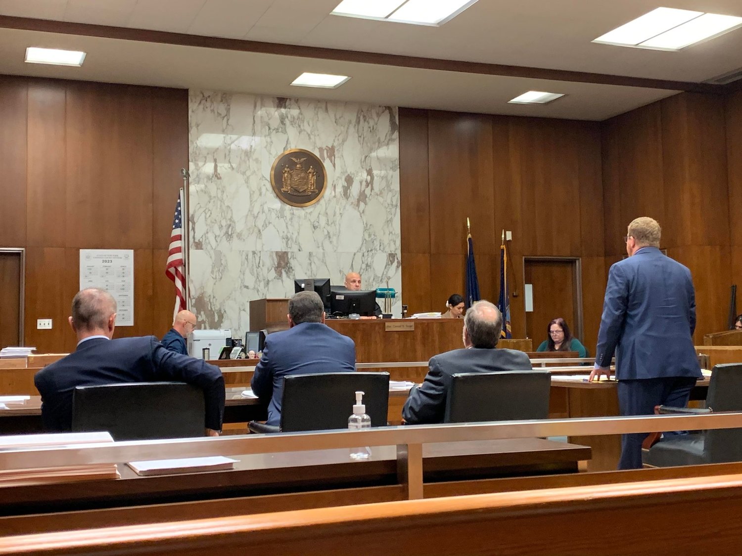 Inside Judge Conrad Singer’s courtroom in Supreme Court in Mineola, Austin Graff, right, argued against four lawyers representing Sanitation commissioners Patrick Doherty and Sheryl Beckman, Town Clerk Kate Murray, Oceanside Sanitation District No. 7, and the Town of Hempstead.