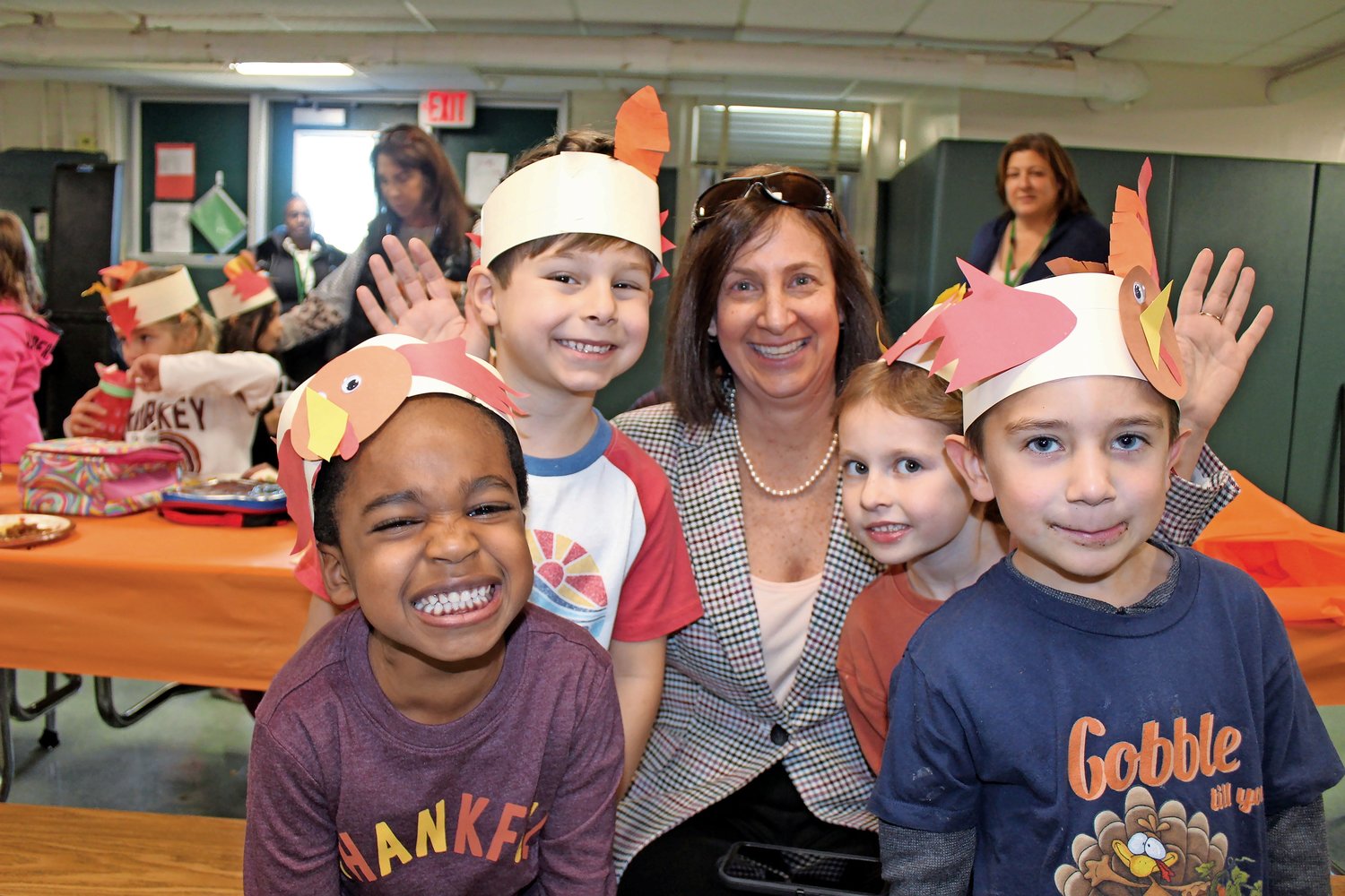 Melissa Burak and students at the Kindergarten Center Thanksgiving Feast.