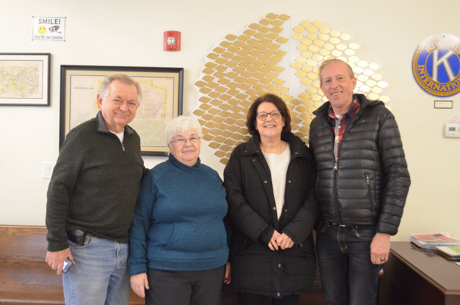 Franklin Square Historical Society members, from left, Bill and Nancy Youngfert, Patricia Realmuto and Paul van Wie have dedicated years of work, as volunteers, to establishing the Franklin Square Museum. Behind them is the donor tree on which they plan to display the names of museum supporters.