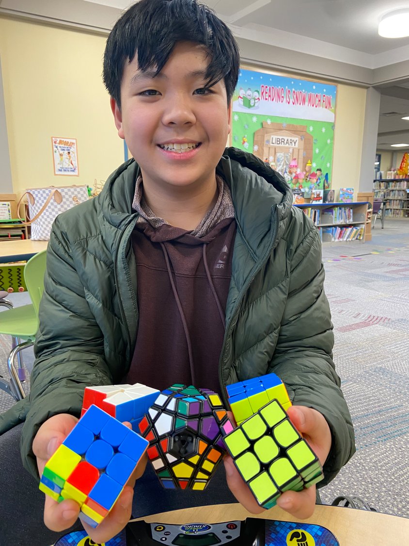 Angelo Dungca, 12, got his start with speedcubing in fourth grade after his mom, Faye, watched a Netflix documentary during the coronavirus pandemic about the sport.