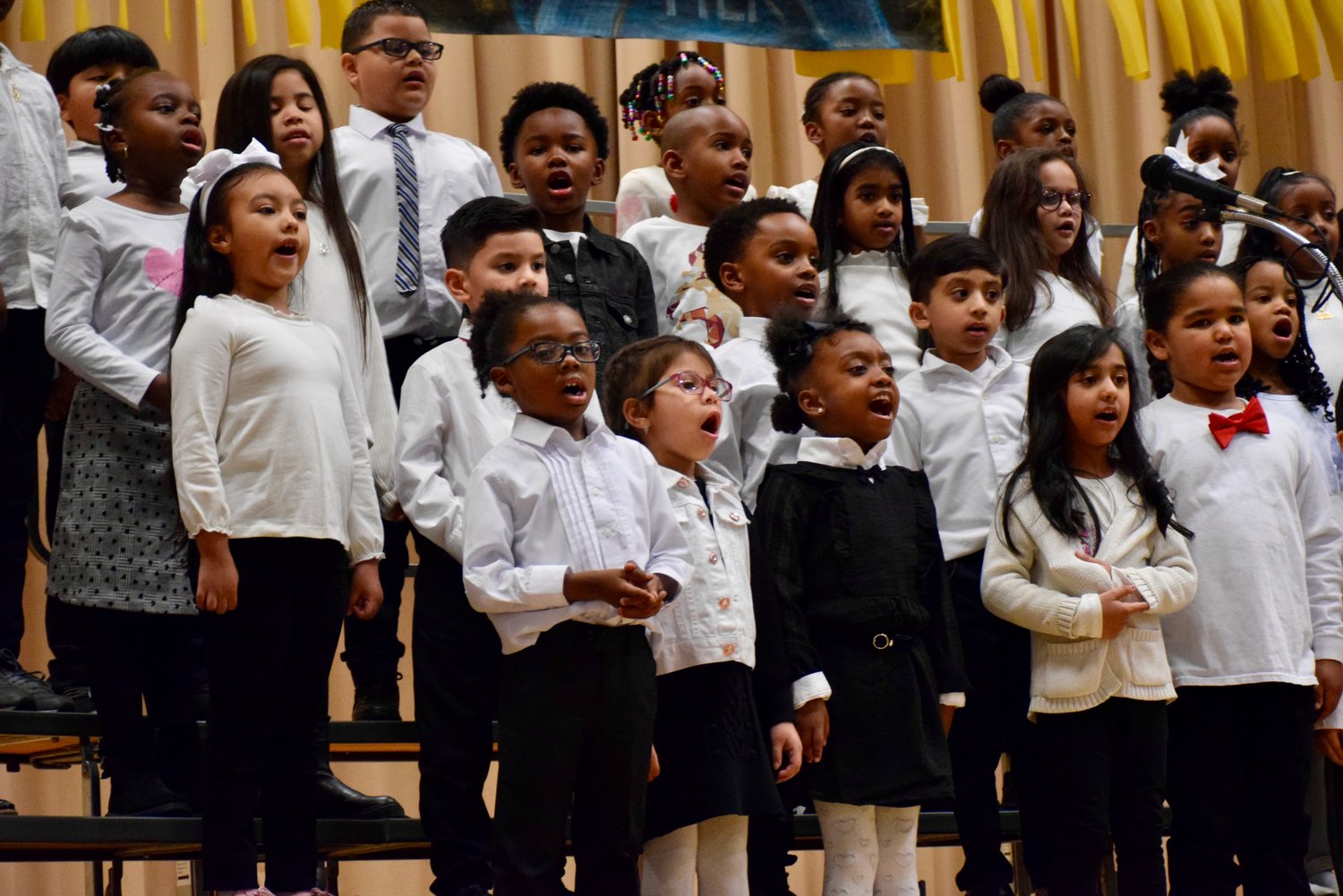 Gotham Avenue School first graders sang their hearts out and performed two songs during the board of education meeting on Jan. 10.