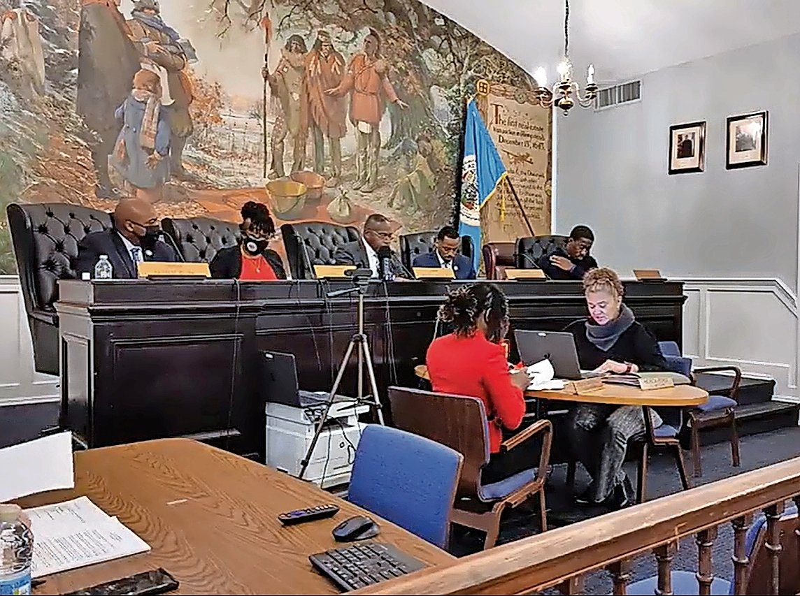 On Dec. 20, 2022, Hempstead Village officials conducted a regular village board meeting, backed by the historic mural that was dedicated in 1944.