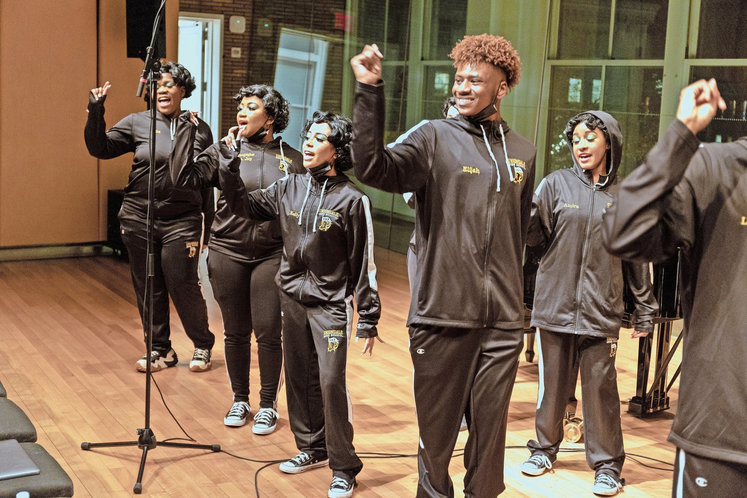 The Show Choir members blasted through a sound check onstage at Carnegie Hall. The students travel and rehearse in track suits, and then switch to their costumes.