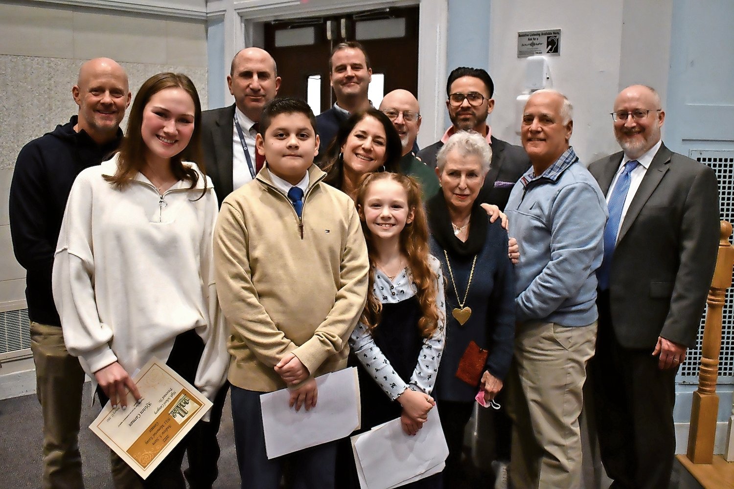 Andrew J. Stern Memorial Essay Contest winners with members of the Stern family and East Rockaway School District Board of Education and Administration at Jan. 17 meeting where winners were honored.