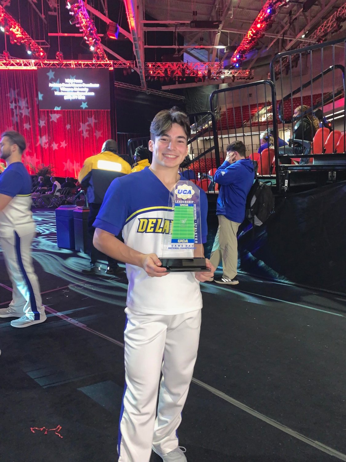 Matthew Guglielmo with his Universal Cheerleaders Association National Competition award, which he won as a member of the University of Delaware cheerleading team.