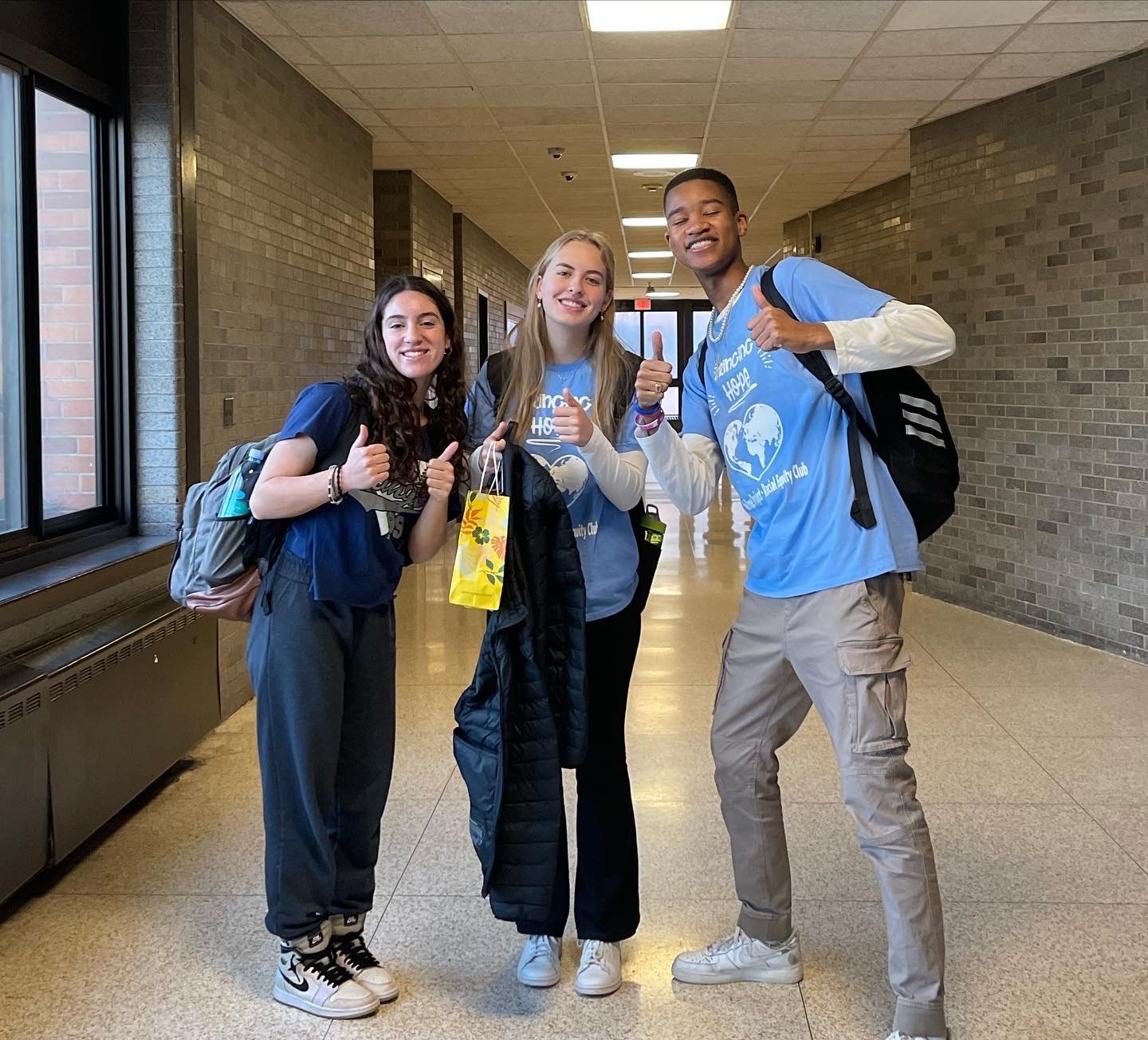 Gabriella Facciponti, Ashleigh Coyne and Nickolas Mascary, members of Calhoun’s Racial Equity Club, wore blue shirts in support of the Hope Project for Haiti.