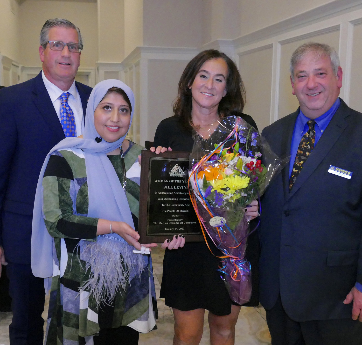 Mills, past president Femy Aziz, and Reiter honored one of the Women of the Year, Jill Levine.