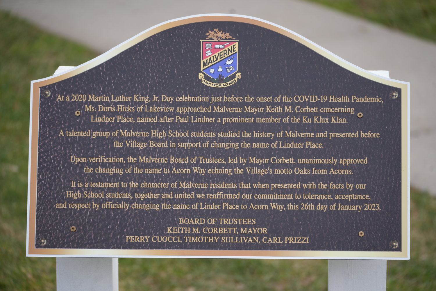 The plaque outside the library explains the history of the street renaming process.