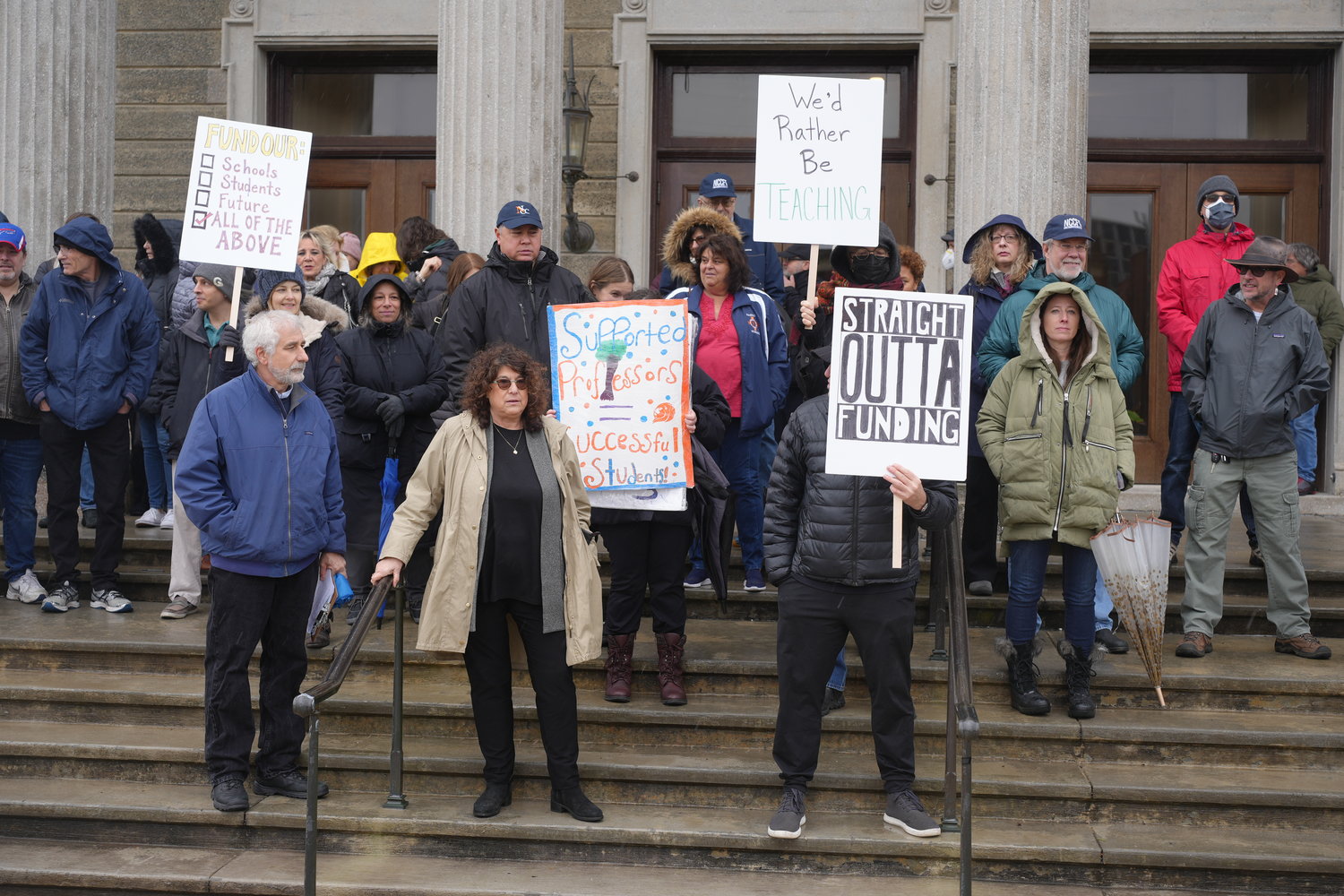 Members of the Nassau Community College Federation of Teachers, an educators union supporting the school’s full-time faculty, gathered at the Nassau County Legislature to demand fair contracts after learning their health care insurance premiums were going up.