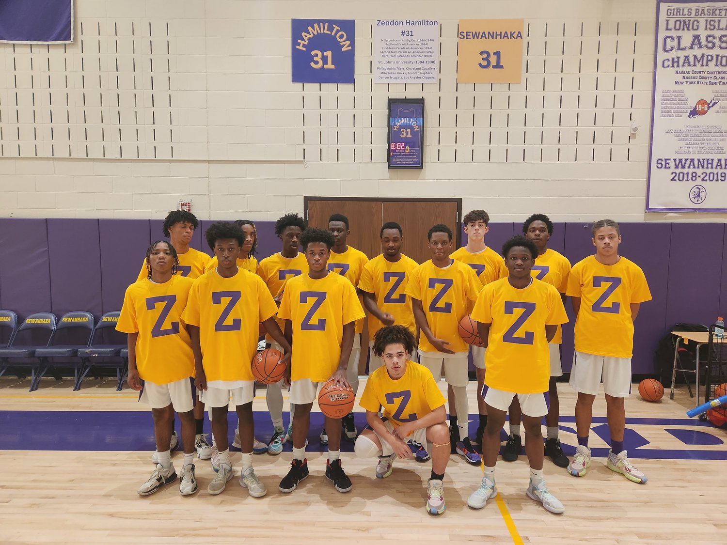 The current members of the Sewanhaka High School boys basketball team show off their uniform sporting the letter ‘Z’ — a tribute to the Sewanhaka Class of 1994 graduate and his inspiring basketball career.