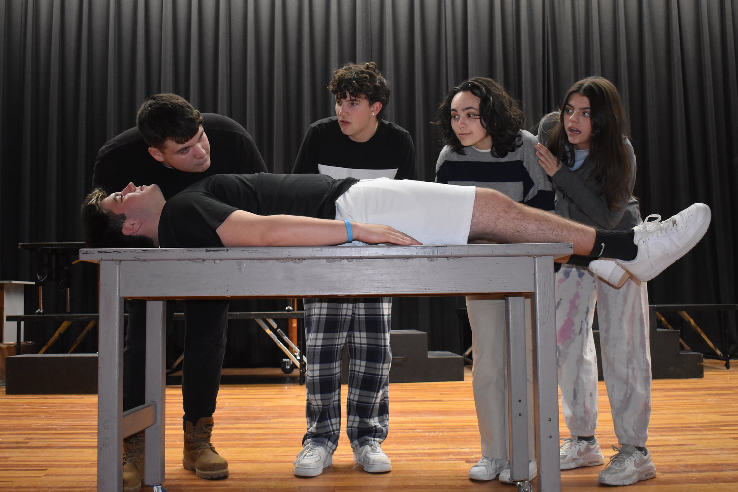 Students, from left, Karl Leudesdorff, Dylan Quinn, Troy Tyznar, Erin Ortiz and Raelyn Luft rehearse a scene from the upcoming musical.