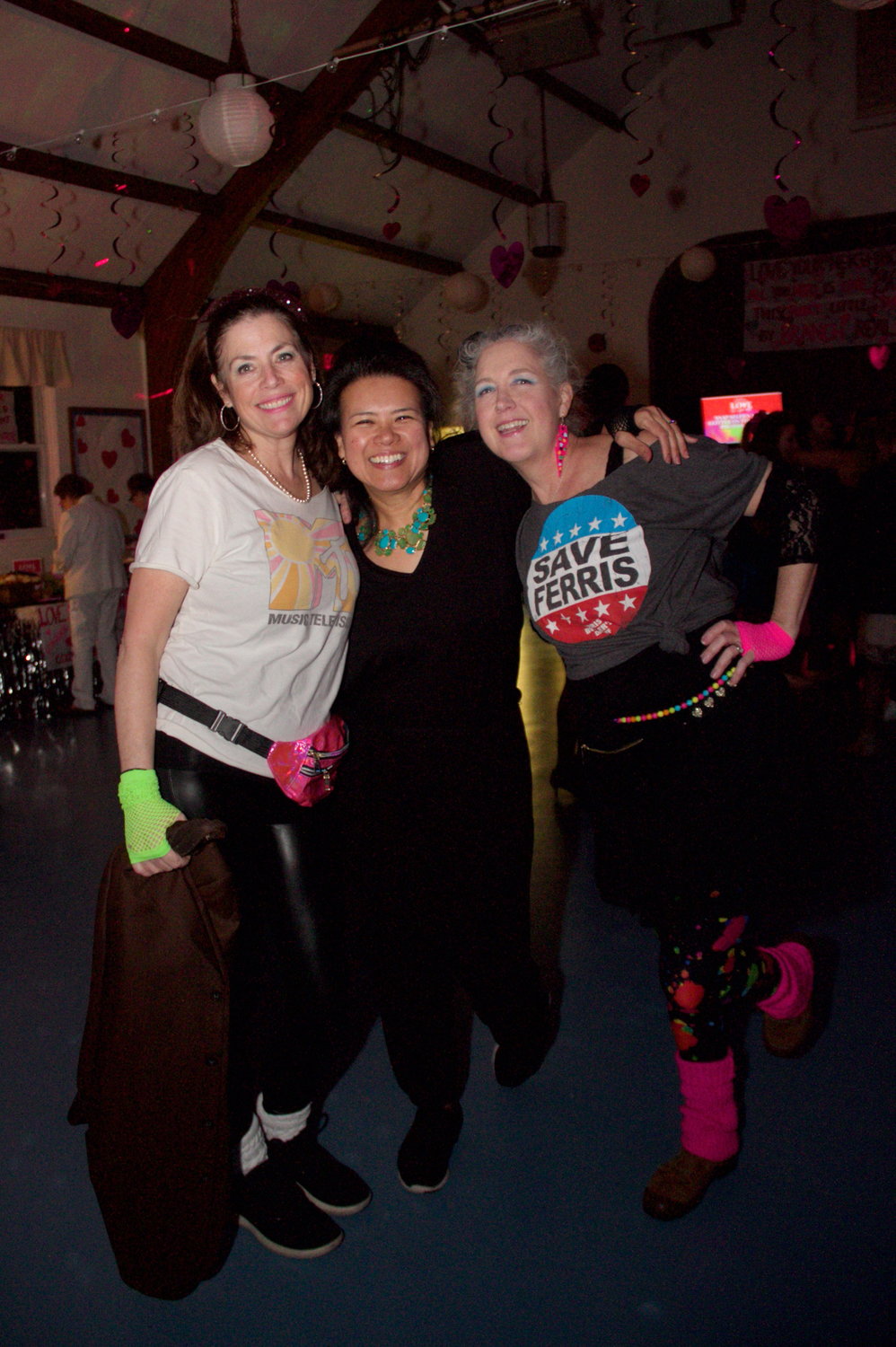 Some attendees went for a look that was more ‘80’s punk than 80’s prom, like Faith Keenan, left, Nan Bischoff and Karen Buschfrers.