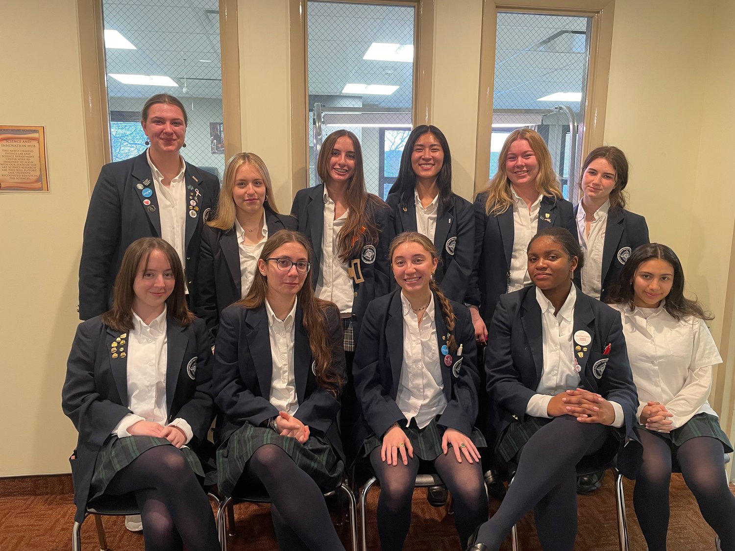 Sacred Heart scholars front row, from left Lauren McCarthy, Cara Carbone, Julia Revill, Gabrielle Augustin, Catalina Ramirez; In the back from left: Madeleine Graham, Katherine Lynch, Ava Guglielmo, Isabel Louie, Olivia Shuff and Kayla Romano.