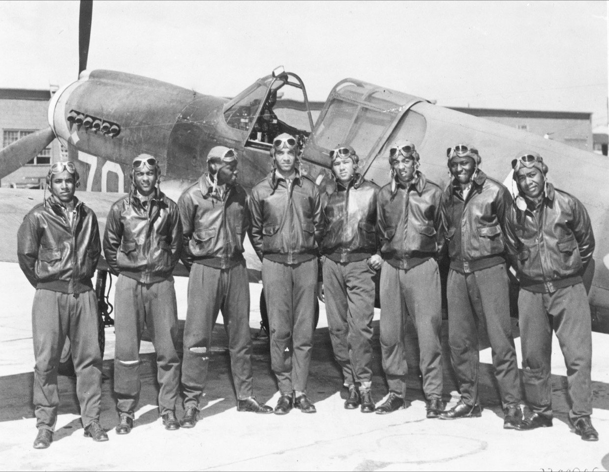 This Tuskegee Airmen photo was likely taken in Southern Italy or North Africa. Its original caption reads, “Class 42-I graduated from flight training on October 9, 1942 at Tuskegee Army Air Field in Alabama. Left to right: Nathaniel M. Hill, Marshall S. Cabiness, Herman A. Lawson, William T. Mattison, John A. Gibson, Elwood T Driver, Price D. Rice, Andrew D. Turner.”