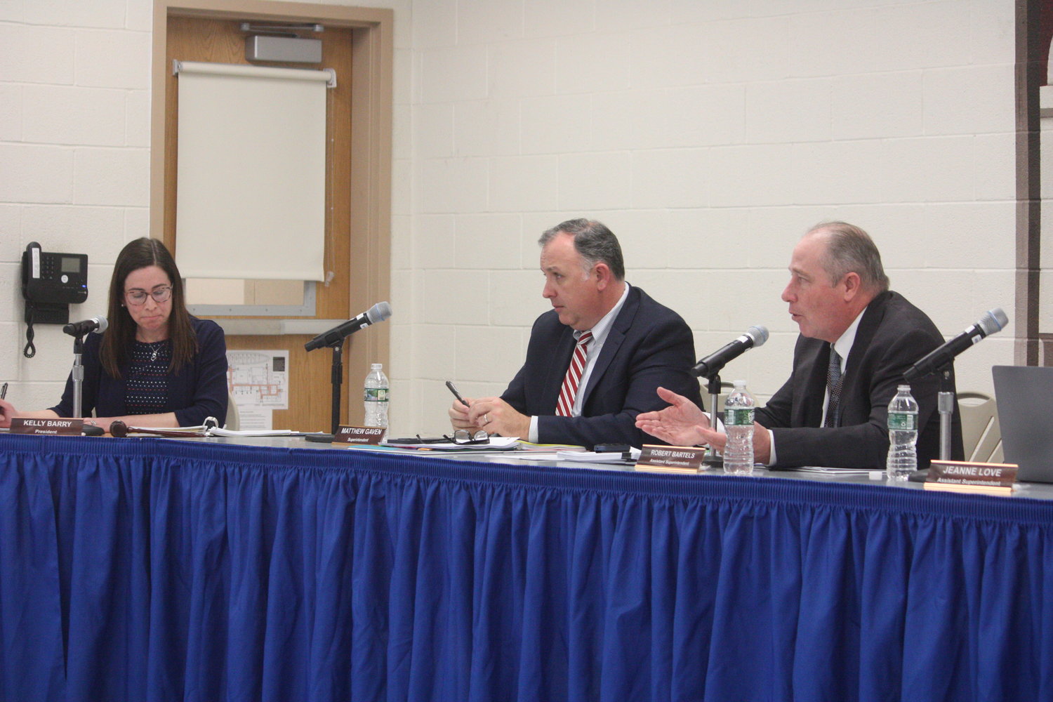 Assistant Superintendent Robert Bartels, far right, with education board president Kelly Barry and Superintendent Matt Gaven presents an overview of the proposed spending plan for the 2023-24 academic year.