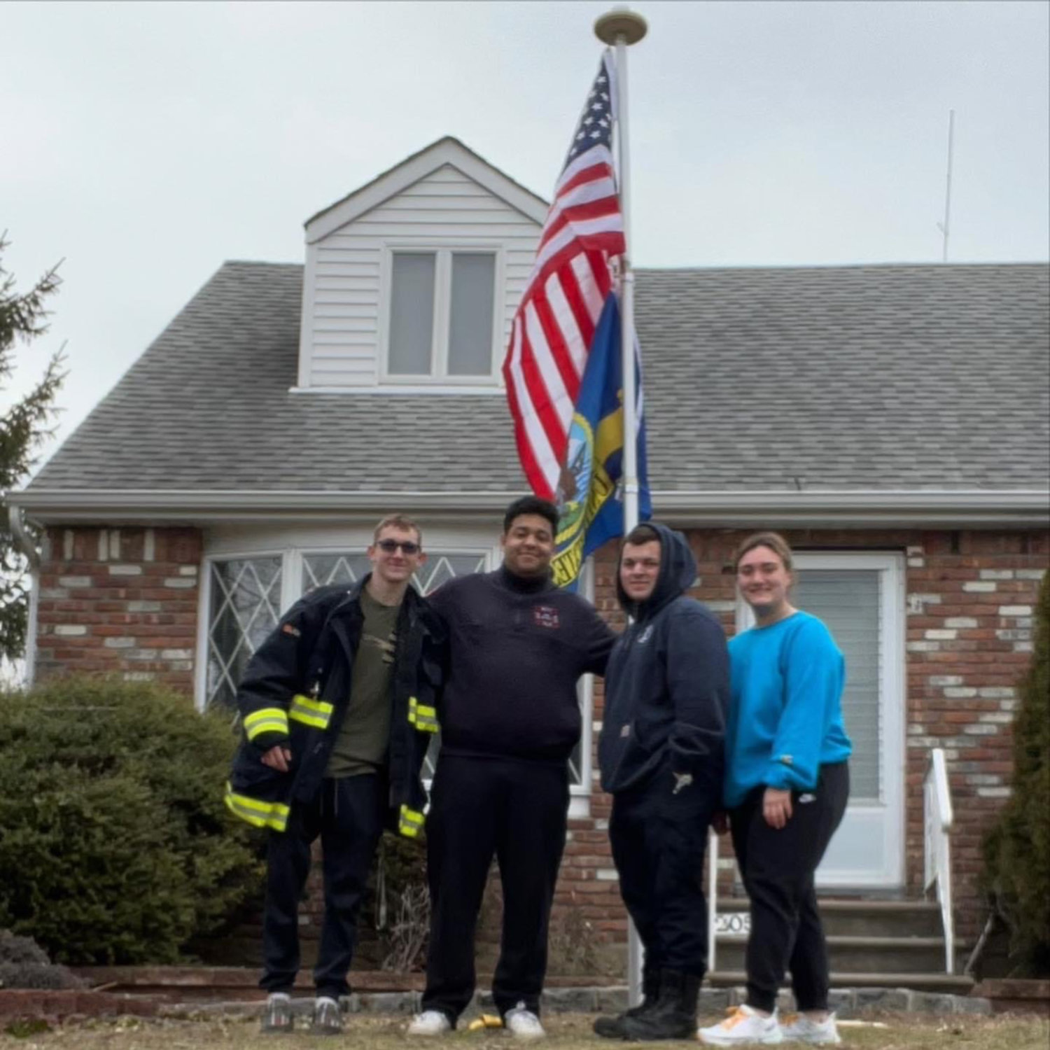 On Feb. 9, EMFD volunteers from left, Aidan Finneran, Omar Benthami, and Connor and Kasey Cheswick went to a vets house to fix his fence and flags.