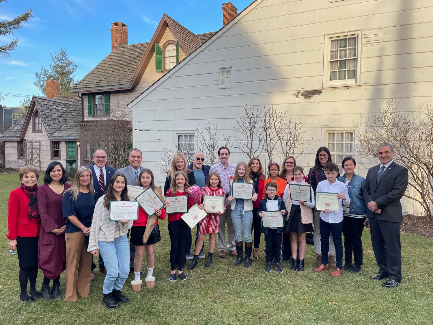 The winners of Raynham Hall’s Valentine’s Day Poetry Contest gathered outside the museum with educators and administrators from the Oyster Bay-East Norwich School District.