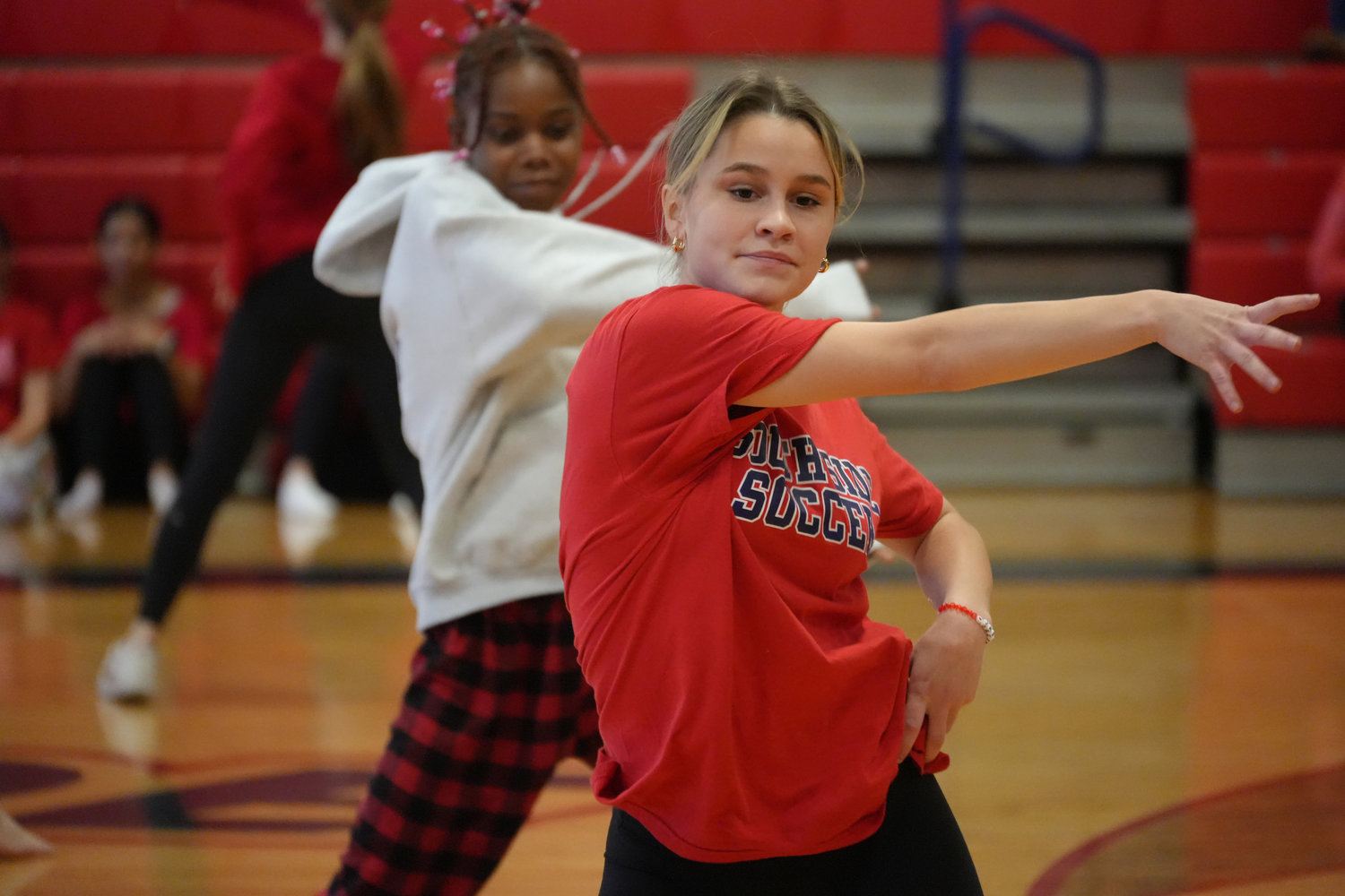 Sarah Schafer and the Red team rehearse their dance moves in preparation for the big competition