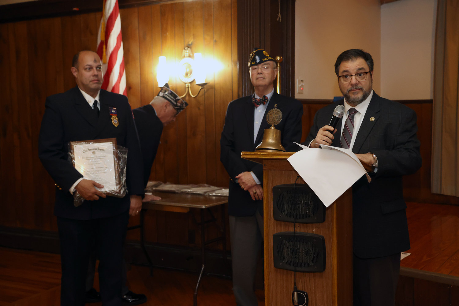 Deputy Mayor Perry Cuocci presents the Volunteer Ambulance Corp. Award to President Luis Lora.