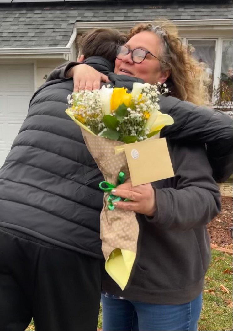 C.J. Cascio, a Baldwin High School senior and a member of Boy Scout Troop 824, hugged Lorrie Prager, an          administrator for the Facebook group ‘Feed Long Island and Donate Anything,’ after they prepared more than 90 birthday packages as part of Celebrate You, an  initiative aimed at providing Nassau County families in need with supplies for birthday parties for their children.