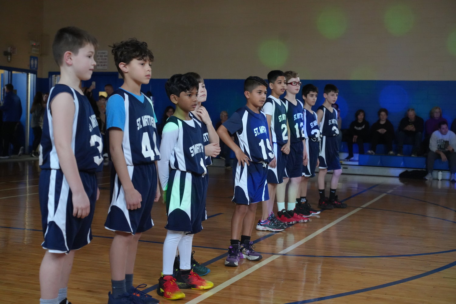 The fifth-grade team from St. Matthew’s, in Dix Hills, was the focus of strobe-lit attention before they played St. Martin of Tours, from Bethpage.
