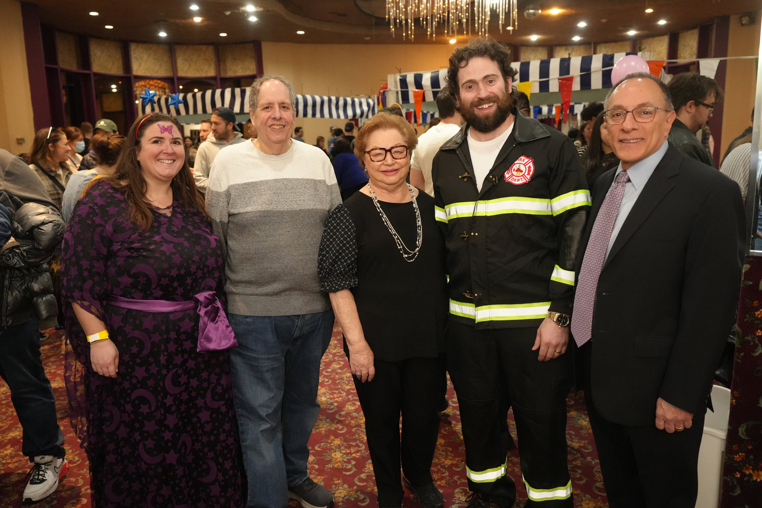 At the 28th Annual Mel Polay Purim Carnival, Reb Rishe Groner, President of Congregation Beth Ohr Joseph Weisbord, carnival organizer Evelyn Polay, Cantor Joshua Diamond, and Legislator Michael Giangregorio. Polay created the carnival 28 years ago, in honor of her late husband, Mel.