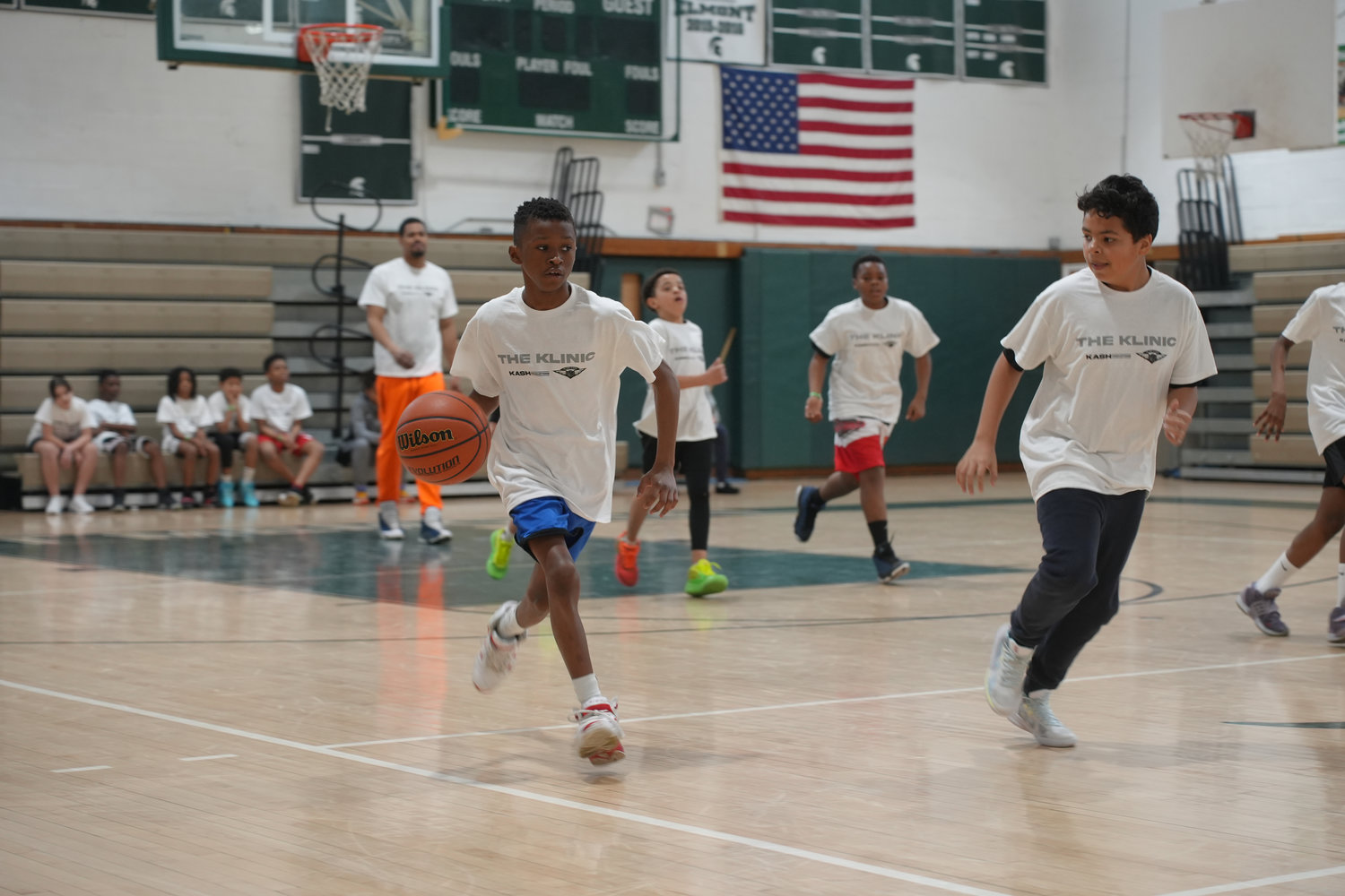 Jacob Reid, 12, of Elmont heads down the court during a Klinic Kids basketball game.