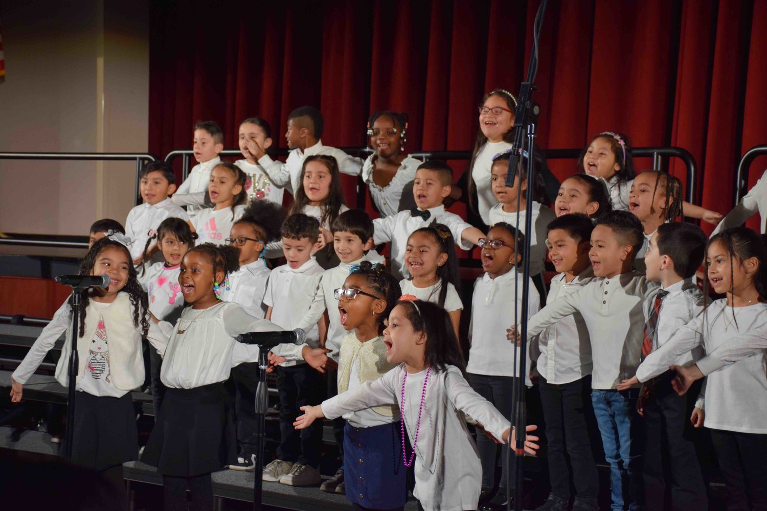 Opening the Black History Month celebration, the kindergarten chorus from Columbus Avenue performed We are Here.
