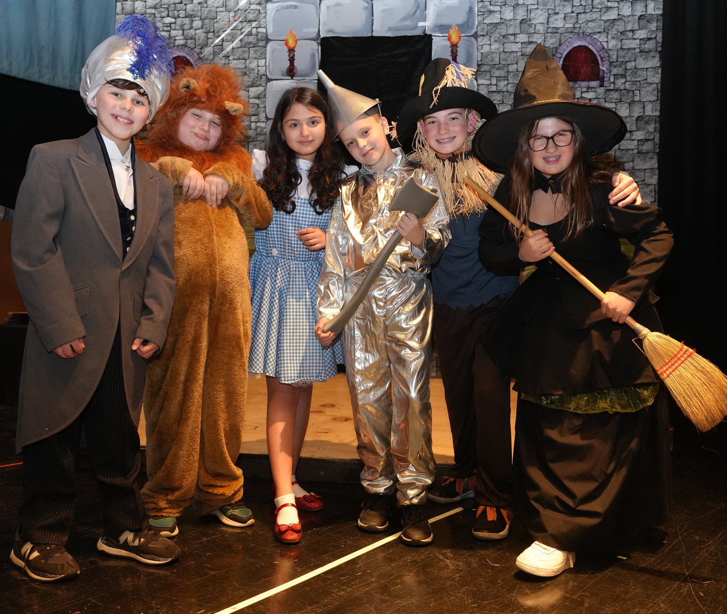 Sixth-graders, from left, Nathan Cook, Tyler Cruise, Emma Klein, Michael Martino, Joseph Len-tini and Mia Mucci, dressed in character, for North Merrick schools’ production of ‘The Wizard of Oz.’