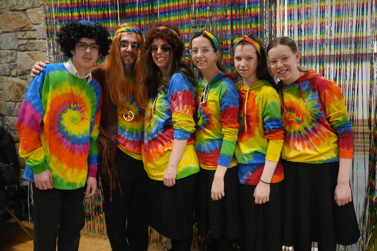Rabbi Shimon Kramer, and his wife Chanie, with their kids, from left, Leibel, Mirel, Leah and Sarah. Each came dressed in 60’s apparel to celebrate the festive night.